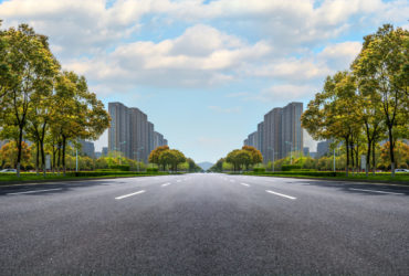 Asphalt road and modern city Asphalt road and modern city